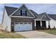 Attractive home featuring a two-car garage, covered entry, and well-maintained landscaping at 1060 Fairhaven Dr # 96, Mebane, NC 27302