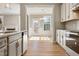 Charming kitchen view with stainless steel appliances, white cabinets, and natural light at 1060 Fairhaven Dr # 96, Mebane, NC 27302