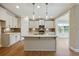 Modern kitchen showcasing a center island with stainless steel appliances and granite countertops at 1060 Fairhaven Dr # 96, Mebane, NC 27302