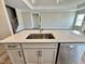 Kitchen island with stainless steel sink, granite countertops, and modern fixtures at 1060 Fairhaven Dr # 96, Mebane, NC 27302