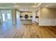 Open-concept kitchen with hardwood floors and modern finishes, featuring kitchen island at 1060 Fairhaven Dr # 96, Mebane, NC 27302