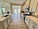 Beautiful kitchen boasts stainless steel appliances, granite counters, and a convenient island at 1060 Fairhaven Dr # 96, Mebane, NC 27302
