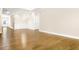 Open living room with hardwood floors and large entryways at 1060 Fairhaven Dr # 96, Mebane, NC 27302