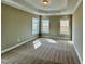 Spacious main bedroom with a tray ceiling, plush carpet, and bright windows at 1060 Fairhaven Dr # 96, Mebane, NC 27302