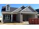 Modern exterior showcasing a two-car garage and attractive architectural details at 180 Brunswick Dr, Nashville, NC 27856