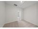 Simple bedroom with carpeted floor and door to another room at 20 Nettle Ln # 239, Clayton, NC 27520