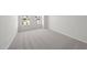 Well-lit bedroom with neutral carpet and two windows at 20 Nettle Ln # 239, Clayton, NC 27520