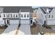 Three-unit townhome building with attached garages and landscaping at 20 Nettle Ln # 239, Clayton, NC 27520