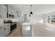 Modern kitchen with gray cabinets, quartz countertops, and stainless steel appliances at 20 Nettle Ln # 239, Clayton, NC 27520