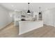 Modern kitchen with gray cabinets, quartz countertops, and island at 20 Nettle Ln # 239, Clayton, NC 27520