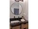 This bathroom showcases a marble countertop with a white undermount sink at 2704 Ross Rd, Durham, NC 27703