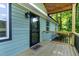 Welcoming porch with a decorative glass front door, a 'hello' mat, and fresh paint at 2704 Ross Rd, Durham, NC 27703