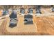 An aerial view of a neighborhood featuring newly built homes with modern designs and spacious front yards at 585 Husketh Rd, Youngsville, NC 27596