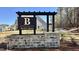 An ornate stone sign for Bartlett Manor, a residential community with newly built homes at 585 Husketh Rd, Youngsville, NC 27596