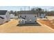 Two story gray home with freshly laid sod and neighborhood views at 585 Husketh Rd, Youngsville, NC 27596