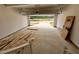 Spacious garage with an open garage door, overlooking the new driveway and neighborhood at 6040 Scalybark Road, Durham, NC 27712