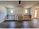 Spacious living room with a cozy fireplace, built-in shelving, and plenty of natural light at 6040 Scalybark Road, Durham, NC 27712