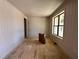 Unfinished room showcasing new paint, electrical outlets, a large window and newly installed walls at 6040 Scalybark Road, Durham, NC 27712