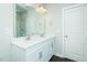 Bathroom featuring double vanity with brushed nickel hardware and wood-look flooring at 286 Yellowwood Ave, Spring Hope, NC 27882