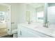 Bathroom with double sink vanity, neutral walls, and wood-look flooring at 286 Yellowwood Ave, Spring Hope, NC 27882