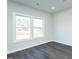 Sunlit bedroom features a large window and neutral decor at 286 Yellowwood Ave, Spring Hope, NC 27882