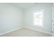 Simple bedroom with neutral paint, carpet, and a single window at 286 Yellowwood Ave, Spring Hope, NC 27882
