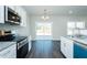 Open kitchen/dining combo featuring modern cabinets and stainless steel appliances at 286 Yellowwood Ave, Spring Hope, NC 27882