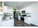 Modern kitchen features stainless steel appliances, granite countertops, and white cabinetry at 286 Yellowwood Ave, Spring Hope, NC 27882