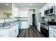 Well-lit kitchen with stainless appliances, granite countertops, and sleek cabinetry at 286 Yellowwood Ave, Spring Hope, NC 27882