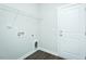 Functional laundry room with wire shelving and door at 286 Yellowwood Ave, Spring Hope, NC 27882