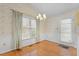 Cozy dining area with bright light from window, and a door to the exterior at 345 Thornwood Ln, Youngsville, NC 27596