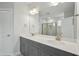 Modern bathroom with a double sink vanity, a large mirror and a walk-in shower at 441 Edison Rail Ln, Knightdale, NC 27545