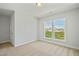 Light bedroom with a view from a double window and neutral carpet at 441 Edison Rail Ln, Knightdale, NC 27545