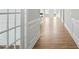 Elegant hallway with hardwood floors, decorative trim, and an inviting view of the home's interior at 441 Edison Rail Ln, Knightdale, NC 27545