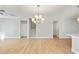Bright living room featuring hardwood floors and a view of the stairs at 441 Edison Rail Ln, Knightdale, NC 27545