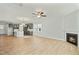 Spacious living room featuring hardwood floors, a fireplace and view of the kitchen at 441 Edison Rail Ln, Knightdale, NC 27545