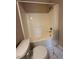 This bathroom features a shower-tub combination with a white shower curtain at 4429 Log Cabin Dr, Raleigh, NC 27616