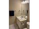 Bathroom with updated vanity, modern mirror, and stylish towel rack at 4429 Log Cabin Dr, Raleigh, NC 27616