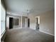 Spacious bedroom with carpet, ceiling fan, and sliding closet doors at 4429 Log Cabin Dr, Raleigh, NC 27616