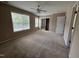 Large bedroom filled with natural light, featuring carpet flooring and large closet at 4429 Log Cabin Dr, Raleigh, NC 27616