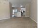 Open-concept view showcases seamless transition from living area to the well-equipped kitchen at 4429 Log Cabin Dr, Raleigh, NC 27616