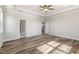 Spacious bedroom with abundant natural light, modern ceiling fan, and easy access to other rooms at 88 Bering Cir, Angier, NC 27501