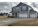 Charming gray two-story home with a wide driveway and well-manicured lawn at 88 Bering Cir, Angier, NC 27501