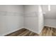 Spacious walk-in closet featuring laminate wood floors and wire shelving at 88 Bering Cir, Angier, NC 27501