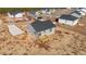 Aerial view of a gray house with a deck and yard at 145 Brookhaven Dr, Spring Hope, NC 27882