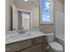 Clean bathroom with vanity, toilet, and bathtub at 145 Brookhaven Dr, Spring Hope, NC 27882