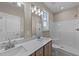 Modern bathroom with double vanity and shower/tub combo at 145 Brookhaven Dr, Spring Hope, NC 27882