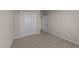 Bright bedroom with double doors and wall-to-wall carpet at 145 Brookhaven Dr, Spring Hope, NC 27882