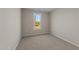 Well-lit bedroom featuring a large window and carpeted floors at 145 Brookhaven Dr, Spring Hope, NC 27882