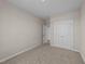 Simple bedroom with double doors and carpeted floors at 145 Brookhaven Dr, Spring Hope, NC 27882
